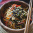 Pan-fried noodles with tomatoes, and sesame seeds